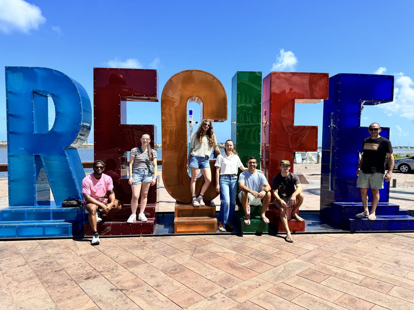 Academy members at the Recife sign in Brazil